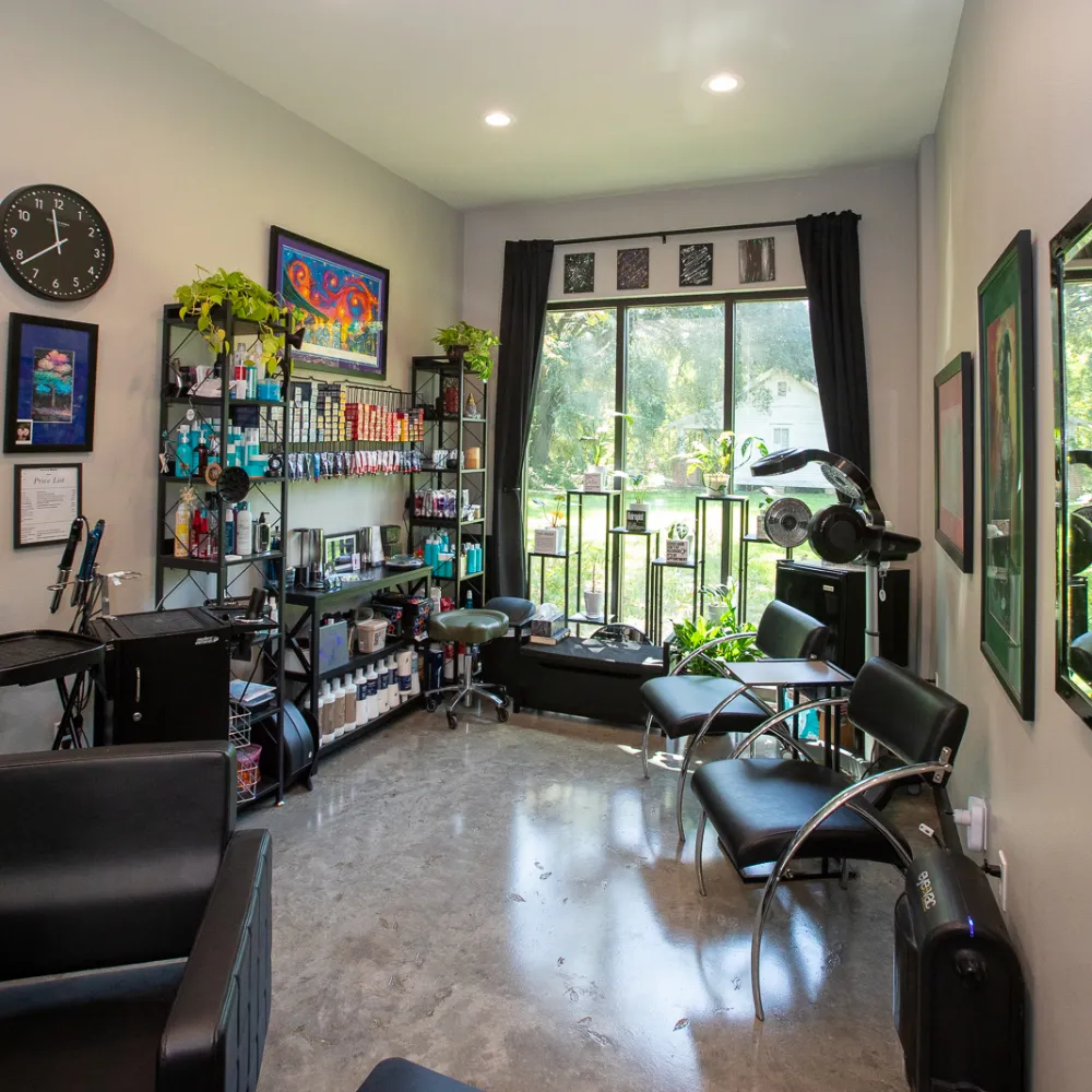 Large salon suite with two styling stations and product wall at Belle Vie The Suites in Ponchatoula, LA
